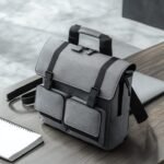 black-grey-backpack-sits-table-notebook_1109427-6657 Minimalist Business Backpack